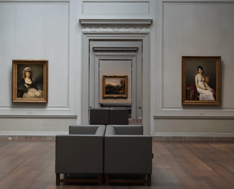 Decorative image of a formal art gallery interior.